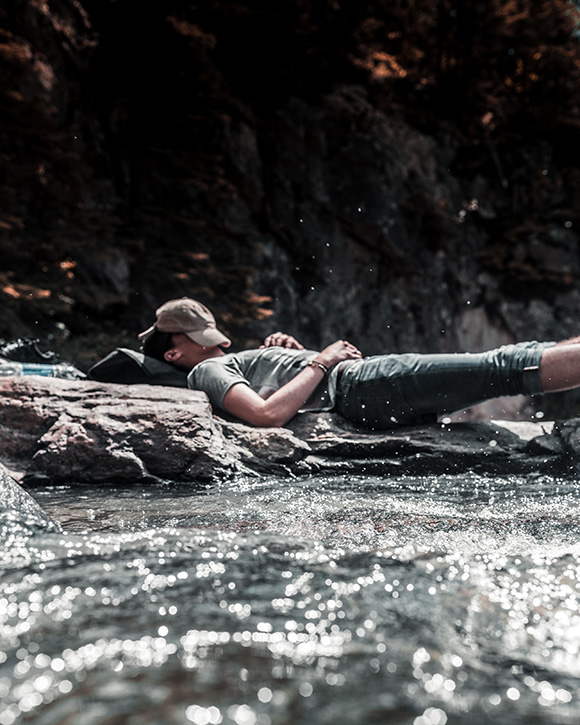 Man sleeping in stream